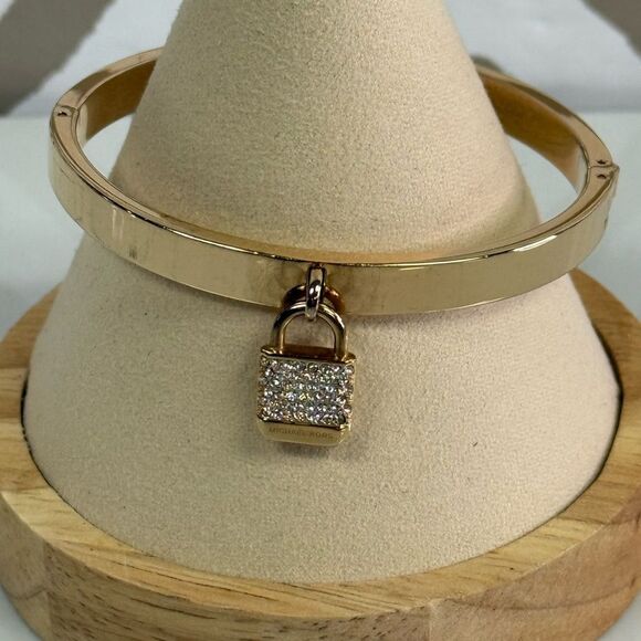 Michael Kors Goldtone Iconic Pace Lock Hinged Bracelet - Picture 2 of 7